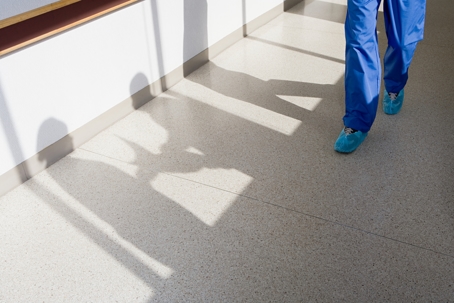Surgeon walking down corridor